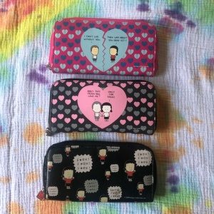 Three angry little girls zipper wallets